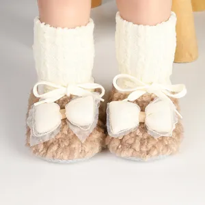 Cozy baby girl winter fleece sock shoes featuring large decorative bows and knit tops