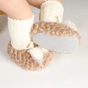 Close-up of anti-slip sole and soft faux fur detail on infant winter fleece socks shoes