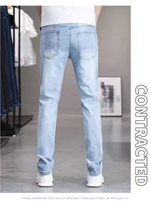 Back view of men's slim fit light blue stretch denim jeans in a showroom