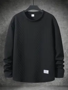 Detailed view of black textured long sleeve sweatshirt with a rhombus knit pattern