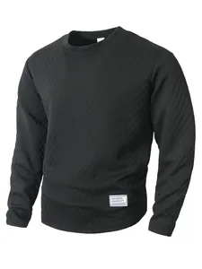 Detail view of black textured long-sleeved sweatshirt with round neck