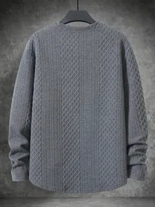 Detail view of a premium grey textured long-sleeve knit sweater with diamond patterns