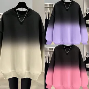 Detailed view of three oversized gradient sweatshirts in cream, purple, and pink colors.