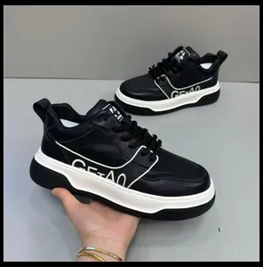 Detailed view of men's premium black leather sneakers featuring thick platform soles.