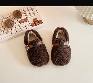 Cozy brown fleece toddler walking shoes featuring a leather strap for winter warmth.