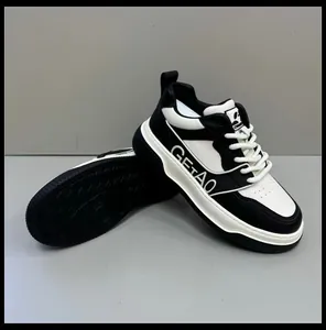 Detail of black and white men's leather sneakers with thick soles and GETAO branding.