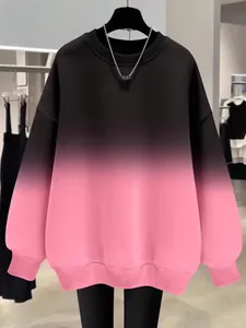 Front view detail of a black to pink gradient oversized sweatshirt for women