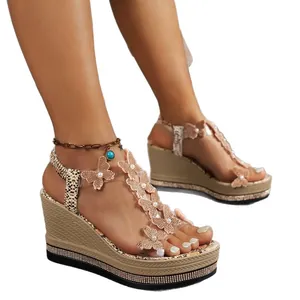 Elegant women's wedge sandals featuring butterfly embellishments and rhinestone platform.