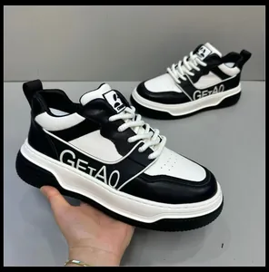 Macro view of the premium black and white leather sneakers featuring thick soles