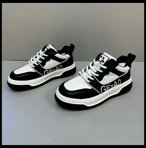 Detailed side view of premium black and white leather casual sneakers with thick soles for men