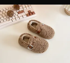 Warm brown plush toddler shoes with metallic buckle detail for cozy autumn and winter steps.