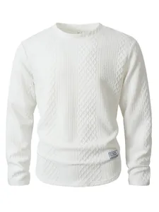 Close-up detail of a white long-sleeve crewneck sweater with textured knit pattern