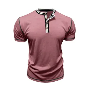 Close-up of men's dusty pink Henley t-shirt with striped collar and buttons