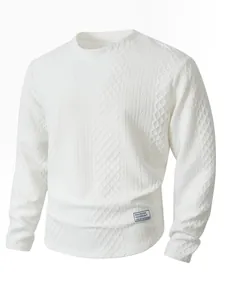 Close-up of white ribbed crewneck pullover showing cable knit texture and hem patch.
