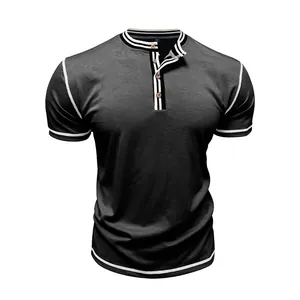 Macro view of men's Henley T-shirt featuring contrast striped collar and wooden buttons