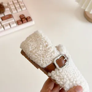 Cozy off-white sherpa baby loafers with brown leather buckle strap for winter toddlers
