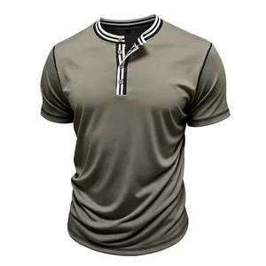 Close-up of olive green men's short sleeve Henley T-shirt with striped collar detail