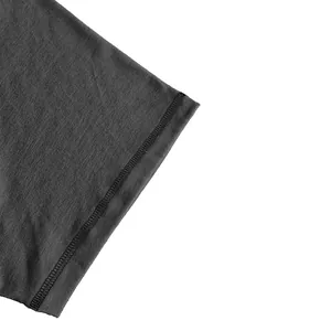 Detailed view of the fine stitching and dark grey cotton fabric on a men's t-shirt.