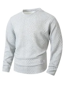Macro shot of gray textured sweatshirt featuring a diamond knit pattern and side patch detail.