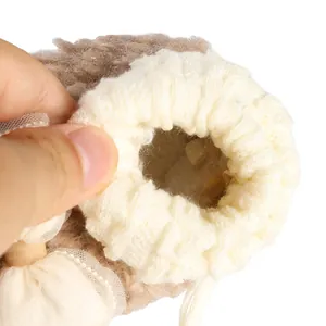Close-up detail of the soft plush lining and elastic cuff on winter baby sock shoes
