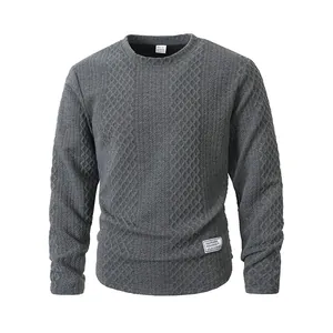Detailed view of dark grey textured knit sweatshirt with a soft crewneck design