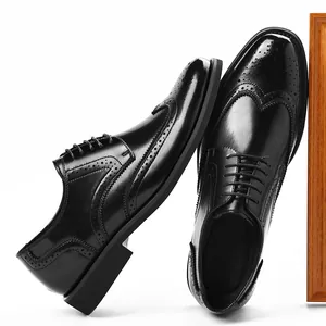 Classic men's black leather Brogue dress shoes with decorative stitching for formal business