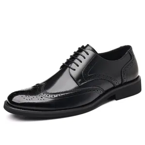 Classic men's black leather brogue shoes with wingtip detail for business or weddings