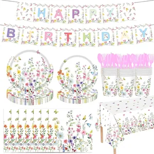 Detailed view of wildflower themed party tableware set with plates, cups and banners