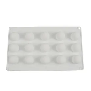 Detail macro view of white 15-cavity round silicone mold for chocolate and cake