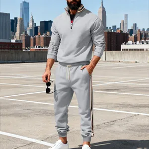 Full view of men's grey heavyweight tracksuit with contrast stripe details and zip collar