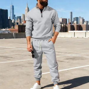 Detailed view of men's grey stand collar sweatshirt and side striped joggers