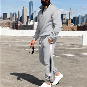 Men's heavy grey sweatshirt set with stylish contrast webbing and stand-up collar design.