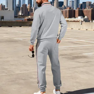Detailed back view of men's grey stand-collar tracksuit with sporty contrast stripes