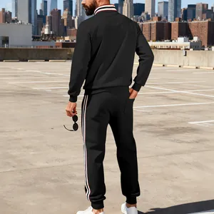 Back view of men's black tracksuit with striped ribbing on collar and pants