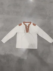 Flat lay of a men's medieval Viking pirate long sleeve shirt with lace-up collar