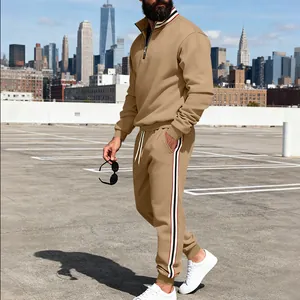 Side view detail of a men's khaki sweatshirt and pants set with striped ribbons