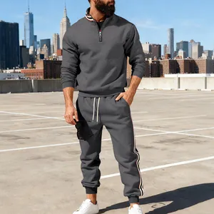 Men's heavyweight grey tracksuit set with contrast webbing details in urban setting