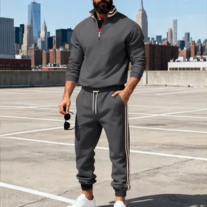 Heavyweight grey men's sweatshirt set with contrast striped webbing on urban rooftop