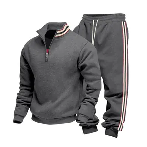 Detailed view of men's heavyweight grey tracksuit with striped collar and cuffs