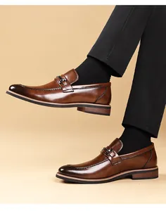 Classic men's brown leather loafers with metal buckle for professional business wear.