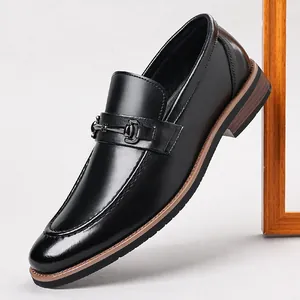 Elegant black leather loafers for men with metal bit detail and stacked heel.