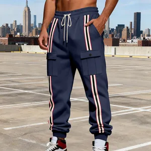 Detail view of men's navy blue cargo joggers with side stripes and drawstring