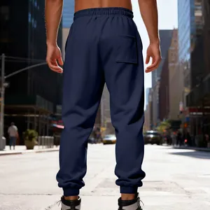 Detailed back view of men's heavy navy fleece-lined joggers featuring elastic waistband