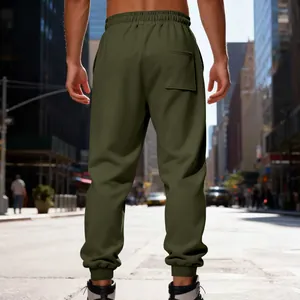 Rear view of men's olive green heavy fleece sweatpants in urban street setting