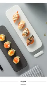 Macro detail of black and white textured ceramic long plates for sushi display