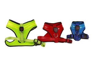 Detailed view of LED dog harnesses in green red blue with integrated power button