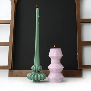 Nordic style ribbed pillar candles featuring unique geometric and pumpkin textures