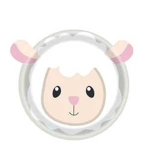 Detail of a cute cartoon sheep face design on a white disposable paper party plate