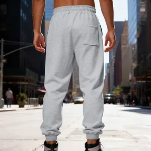Back view of gray heavyweight fleece joggers featuring elastic waist and ribbed cuffs.