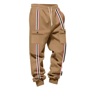 Close-up detail of khaki cargo sweatpants featuring retro striped webbing and flap pockets.